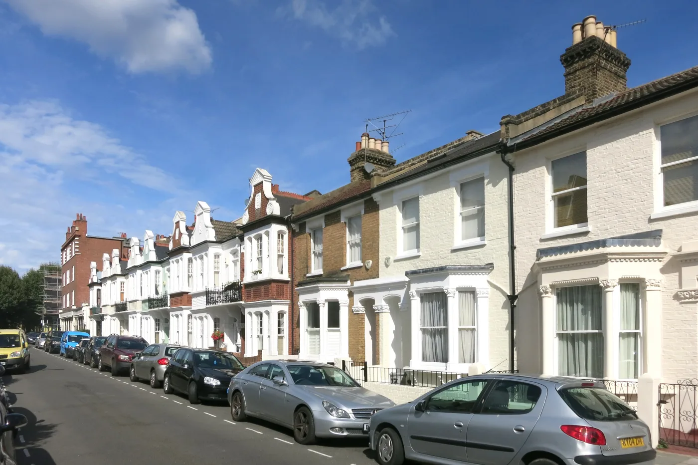 Resident bays on Epple Road, Fulham. Zone controls here and across much of the borough run into the evening